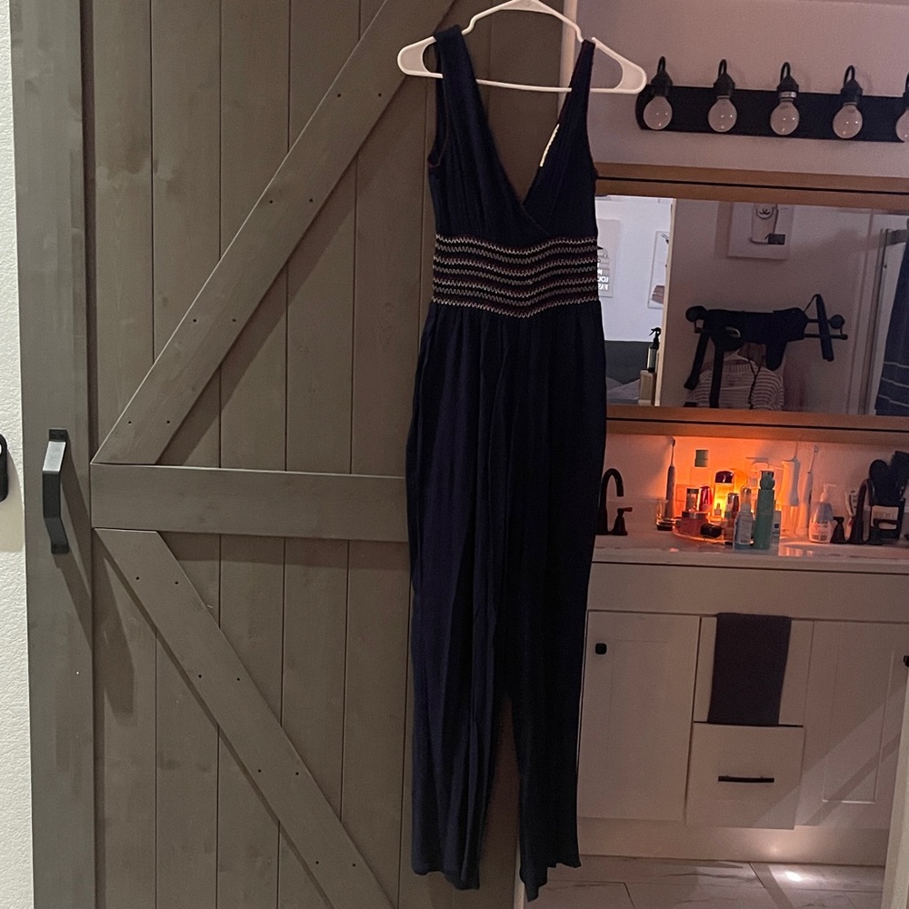 Solitaire navy blue Jumpsuit with red and white Accents